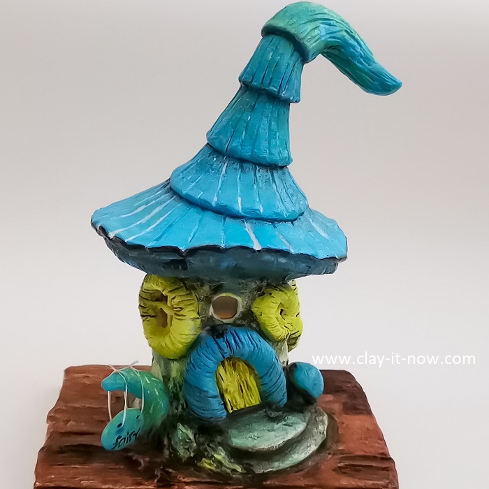 This blue fairy house may not have ordinary colour theme for fairy house. What do you think?
