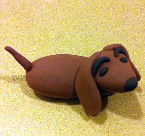 dachshund figurine, short-legged long-bodied dog breed, dachshund