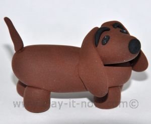 dachshund figurine, short-legged long-bodied dog breed, dachshund